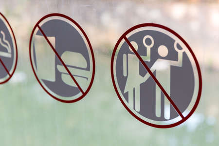 Forbidden to harass, violent or sexual harassed women sign on the public transportation bus in Jakarta, Indonesiaの写真素材