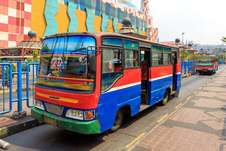 Metro Mini bus on the streets of Jakarta, Indonesia, a common way of public transportationのeditorial素材