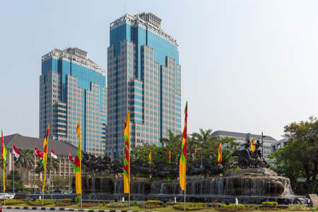 Patung Arjuna Wijaya statue in Central Jakarta, Indonesia. Krishna rides the chariot with Arjuna holding a bow and arrow, pulled by eleven divine horses.のeditorial素材