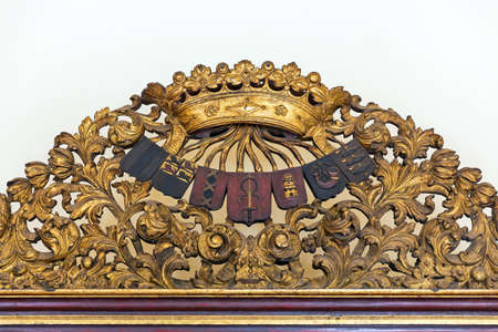 Gold painted wooden ornament on top of a big closet from Dutch colonial VOC times in Indonesiaのeditorial素材