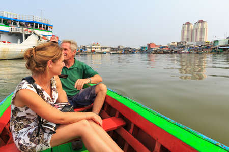 Tourists visit the old Sunda Kelapa harbor area by boat in Jakarta, Indonesiaの写真素材