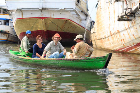 Tourists visit the old Sunda Kelapa harbor area by boat in Jakarta, Indonesia, on August 2, 2015のeditorial素材