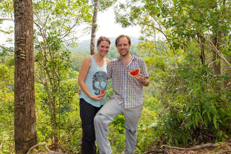 Beautiful tourists posing during an orangutan ecotourism jungle hike in Gunung Leuser National Park, Bukit Lawang, Sumatra, Indonesiaの写真素材