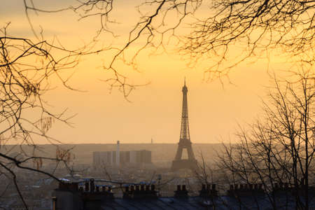Beautiful cityscape skyline sunset view of the Eiffel tower in Paris, France, on a spring evening, seen from Montmartreの写真素材