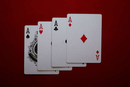 poker cards: four aces on red feltのeditorial素材