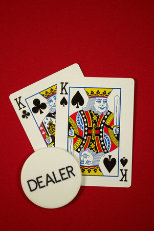 poker hand, pocket kings on the button, on red felt