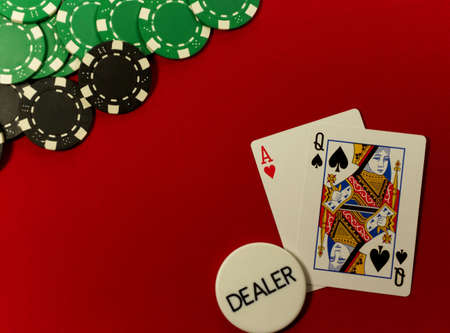 poker hand, ace queen off suited on the button on red feltのeditorial素材