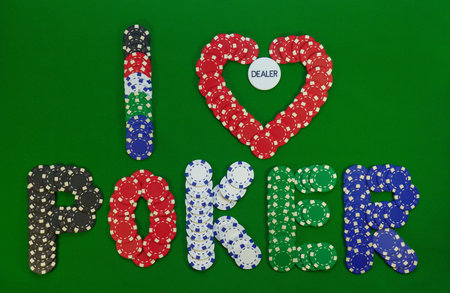 colored chips that make up the inscription I love poker with button inside of heartの写真素材