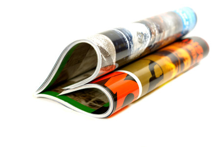 magazine, folded in the form of heart isolated over white