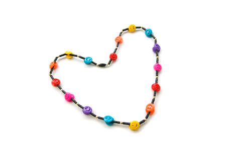 Necklace made in the form of heart isolated over whiteの写真素材