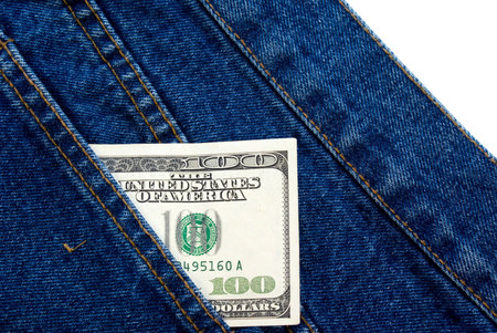one hundred dollar banknote in a blue jeans pocket isolated over white