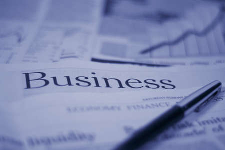 newspaper business page with pen conceptの写真素材