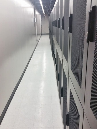Data center shared cabinets and corridor view.