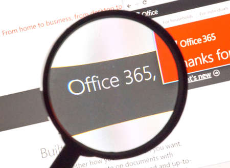 MONTREAL, CANADA - FEBRUARY, 2016 - Microsoft Office 365 on the web under magnifying glass.のeditorial素材