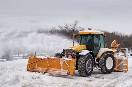 MONTREAL, CANADA - FEBRUARY, 2016 - Snowblower track cleaning a road near Montr Royal park, Montreal. MONTREAL, CANADA - FEBRUARY, 2016 - Snowblower track cleaning a road near Montr Royal park, Montreal.