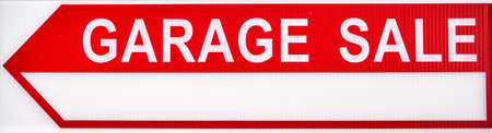 Garage sales red arrow sign on white plastic.の写真素材