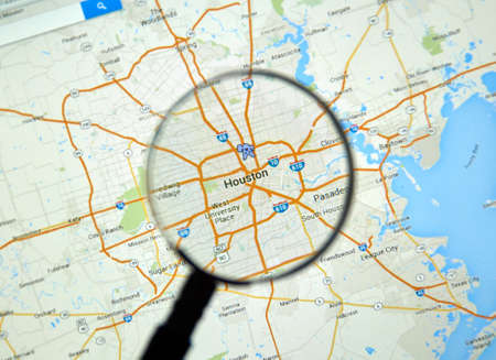 MONTREAL, CANADA - MARCH 17, 2016 -  Houston on Google Maps app under magnifying glass.のeditorial素材