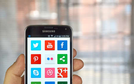 MONTREAL, CANADA - MARCH 20, 2016 - Multiple social media icons on Samsung S5 screen's phone.のeditorial素材