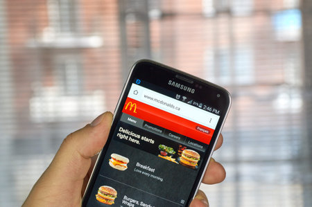 MONTREAL, CANADA - MARCH 20, 2016 - McDonald's  site on Samsung S5's screen. McDonald's is the...