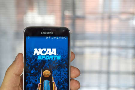 MONTREAL, CANADA - MARCH 20, 2016 - NCAA mobile application on Samsung S5's screen. NCAA is National Collegiate Athletic Association.のeditorial素材