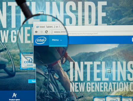 MONTREAL, CANADA - MARCH 25, 2016 - Intel internet page under magnifying glass. Intel Corporation is an American multinational technology company.のeditorial素材