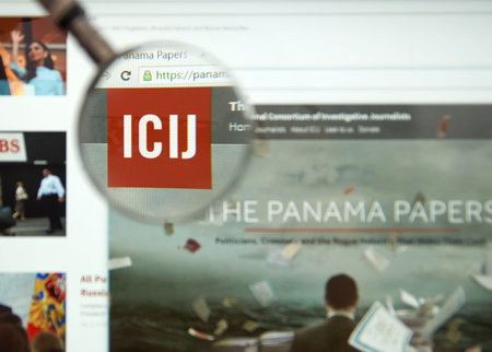 MONTREAL, CANADA - APRIL 5, 2016 : The Panama Papers web page under magnifying glass. It's a leaked...