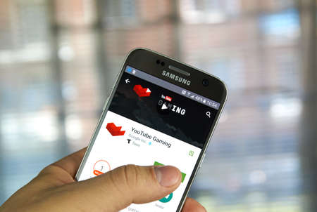 MONTREAL, CANADA - MAY 23, 2016 : Google YouTube Gaming application on Samsung S7 screen. The YouTube Gaming community is a place for Gamers to discuss Gaming.のeditorial素材