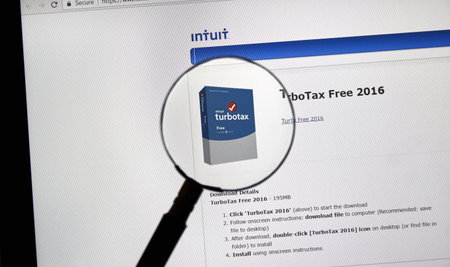 MONTREAL, CANADA - FEBRUARY 12, 2017 - Turbotax page under magnifying glass. Turbotax is an...