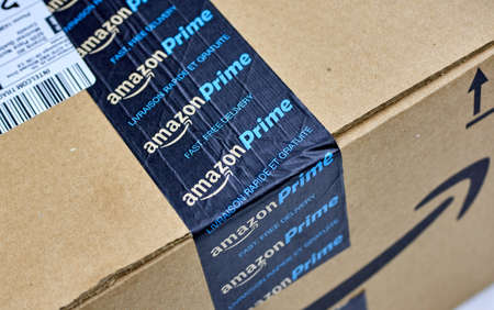 MONTREAL, CANADA - MARCH 28, 2017: Amazon Prime shipping box with branded tape on it. Amazon is an American electronic commerce and cloud computing company.のeditorial素材
