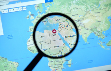 MONTREAL, CANADA - APRIL 09, 2017: Egypt on Google Maps with Explosion icon under magnifying glass.