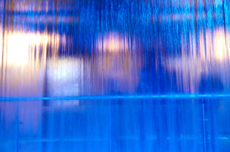 Blurred background. Blurry people behind a waterfall.の写真素材