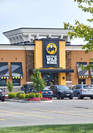 PLATTSBURGH, USA - AUGUST 23, 2017 : Buffalo Wild Wings restaurant and logo. Buffalo Wild Wings is an American casual dining restaurant and sports bar franchiseのeditorial素材