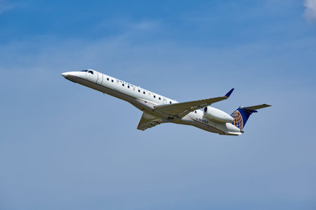 MONTREAL, CANADA - AUGUST 28, 2017 : United Airlines N14153 Embraer taking off. United Airlines, Inc., commonly referred to as United, is a major American airline headquartered in Chicago, Illinois.のeditorial素材