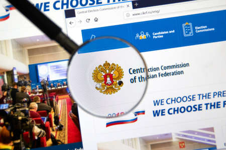 MONTREAL, CANADA - MARCH 13, 2018 : Web site of Central Election Commission of the Russian Federation under magnifying glass. The 2018 Russian presidential election will take place on 18 March 2018.のeditorial素材