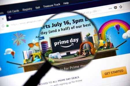 MONTREAL, CANADA - JULY 3, 2018 : Amazon prime day page on official amazon site under magnifying glass. Amazon Prime Day is the retailer's big members-only summer sale in month of July each year.のeditorial素材
