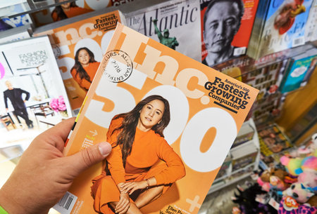 MIAMI, USA - AUGUST 22, 2018: Inc magazine in a hand over a stack of magazines. The Inc. 500 is an annual list of the 500 fastest-growing private companies in the United Statesのeditorial素材