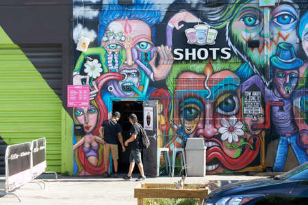 MIAMI, USA - AUGUST 22, 2018: Wynwood Walls Miami graffiti. Wynwood is a neighborhood in Miami, Florida known for its graffiti and street art.のeditorial素材