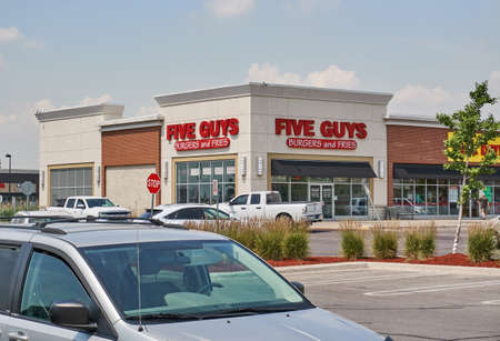 TORONTO, CANADA - August 15, 2018: Five Guys storefront. Five Guys Enterprises LLC is an American fast casual restaurant chain focused on hamburgersのeditorial素材