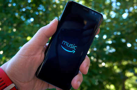 MONTREAL, CANADA - August 28, 2018: Amazon Prime Music android app on Samsung s8 screen in a hand.のeditorial素材