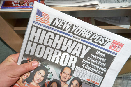 MONTREAL, CANADA - SEPTEMBER 14, 2018: The New York Post newspaper in a hand. The New York Post is a daily newspaper in New York Cityのeditorial素材