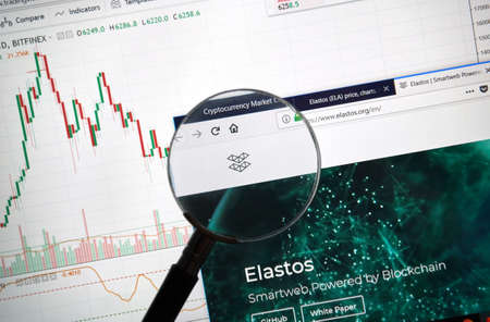 MONTREAL, CANADA - SEPTEMBER 8, 2018: Elastos altcoin site under magnifying glass. Blockchain is a growing list of records which are linked using cryptography.のeditorial素材