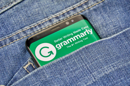 MONTREAL, CANADA - OCTOBER 4, 2018: Grammarly check logo and app on a Samsung s8 screen. Grammarly...