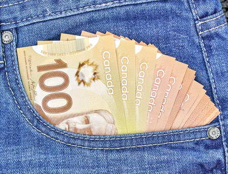 canadian money in a pocket of a blue jeansの写真素材