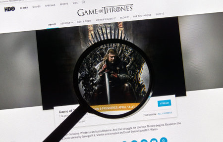 MONTREAL, CANADA - APRIL 14, 2019 : Game of Thrones official HBO site under magnifying glass. The...
