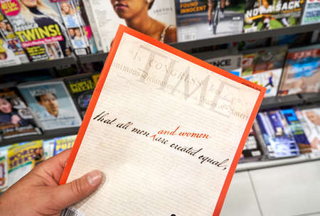 MONTREAL, CANADA - OCTOBER 9, 2018: Time magazine with The United States Declaration of Independence on the front cover in a hand over a stack of magazines.のeditorial素材