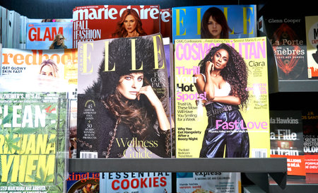 MONTREAL, CANADA - OCTOBER 9, 2018: A stack of women's magazines: Elle, Marie Claire, Glamour...のeditorial素材