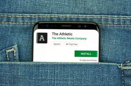 MONTREAL, CANADA - December 23, 2018: The Athletic android app on Samsung s8 screen. The app is a popular sport journalism application by The Athletic Media group.のeditorial素材