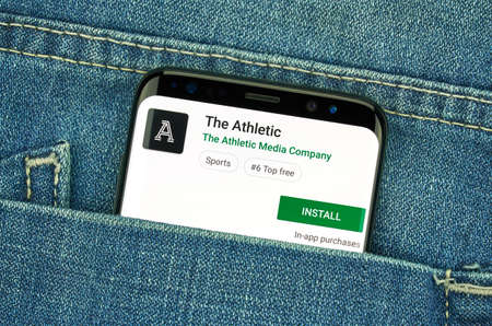 MONTREAL, CANADA - December 23, 2018: The Athletic android app on Samsung s8 screen. The app is a popular sport journalism application by The Athletic Media group.のeditorial素材