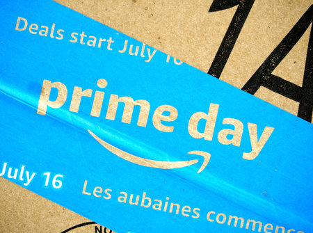 MONTREAL, CANADA - MAY 10, 2019 : Amazon Prime Day cardboard box with Prime Day logo and tape on it. Amazon Prime Day is the retailer's big members-only summer sale in month of July each year.のeditorial素材