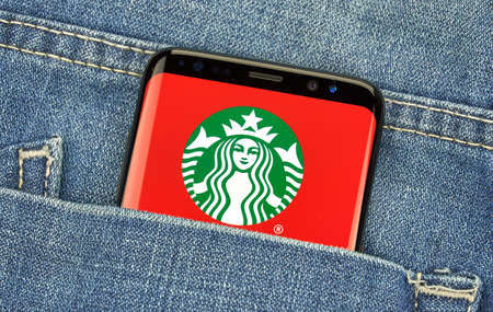 MONTREAL, CANADA - December 23, 2018: Starbucks android app and logo on Samsung s8 screen. Starbucks Corporation is an American coffee company and coffeehouse chain.のeditorial素材